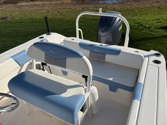 Slide: The Image of Top view of 2024 Robalo R202EX boat layout with seating and console. - 5