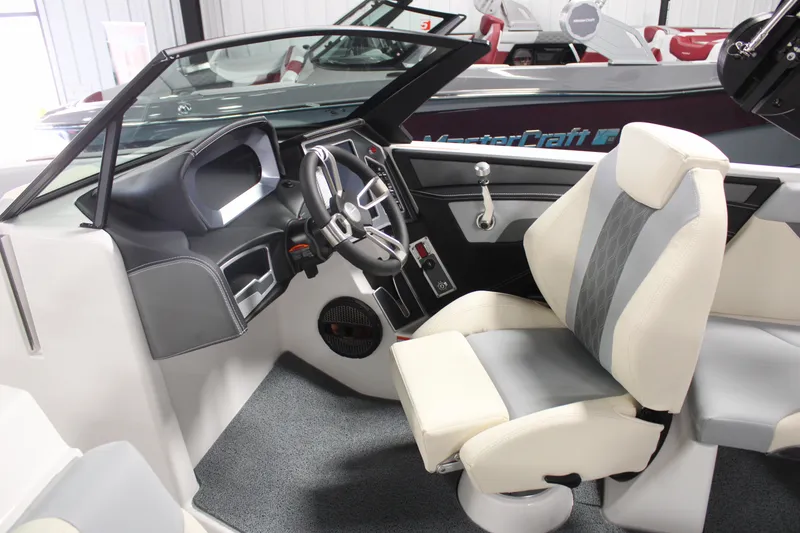 Slide: The Image of 2024 MasterCraft XT24 boat interior with modern dashboard and comfortable seating. - 15