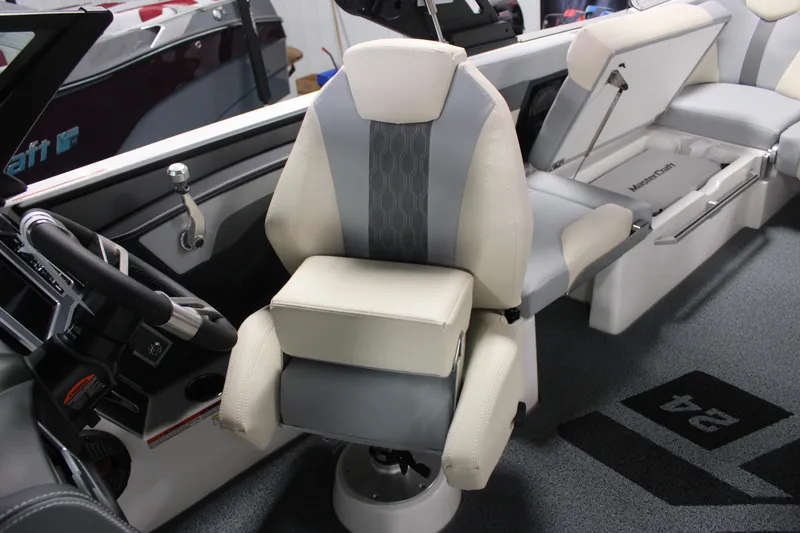 Slide: The Image of 2024 MasterCraft XT24 boat interior with captain's chair and modern dashboard. - 16