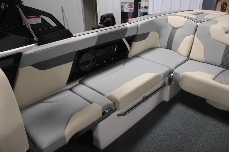 Slide: The Image of 2024 MasterCraft XT24 boat interior with gray and beige seating, showcasing modern design. - 25