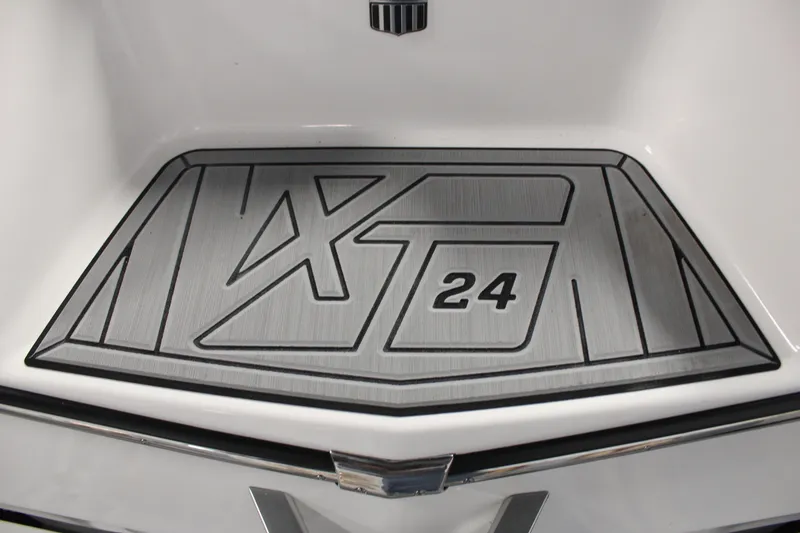 Slide: The Image of 2024 MasterCraft XT24 boat deck with embossed logo design. - 32