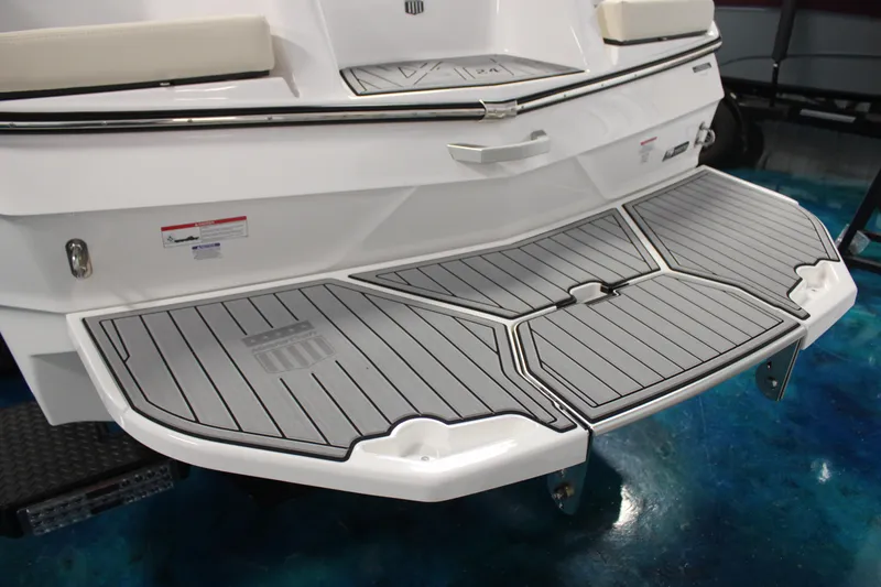 Slide: The Image of 2024 MasterCraft XT24 boat with sleek swim platform and non-slip decking. - 35