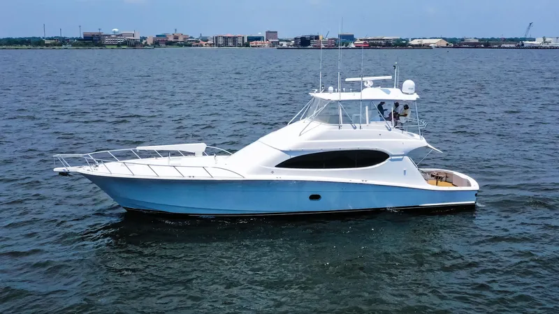 The Image of 2007 Hatteras 68 Convertible yacht cruising on open water. - 0
