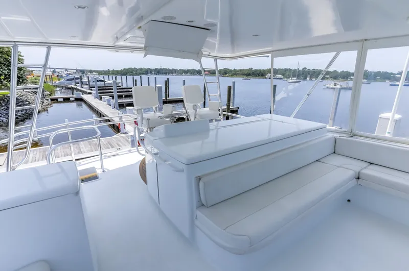 Slide: The Image of Luxurious 2007 Hatteras 68 Convertible yacht interior with marina view. - 10
