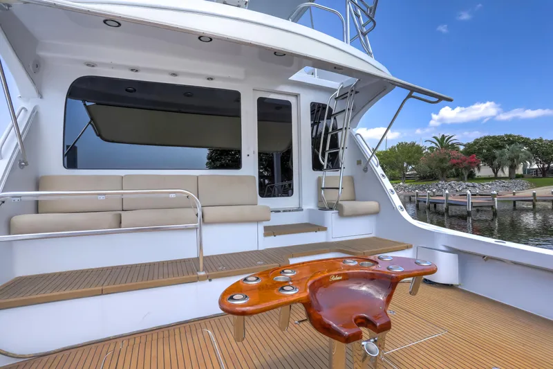 Slide: The Image of 2007 Hatteras 68 Convertible yacht with spacious deck and seating area. - 12