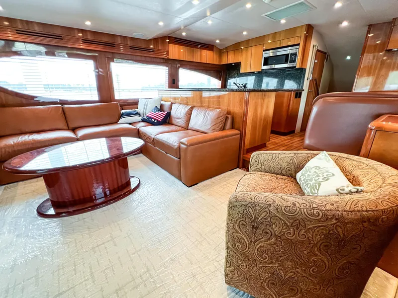 Slide: The Image of Luxurious interior of 2007 Hatteras 68 Convertible yacht with leather seating and modern kitchen. - 16