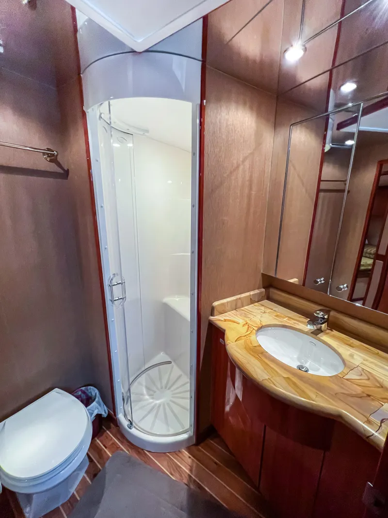 Slide: The Image of Luxurious bathroom in 2007 Hatteras 68 Convertible yacht with shower, sink, and toilet. - 29