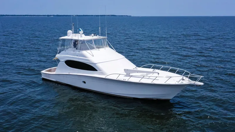 Slide: The Image of 2007 Hatteras 68 Convertible yacht on open water. - 3