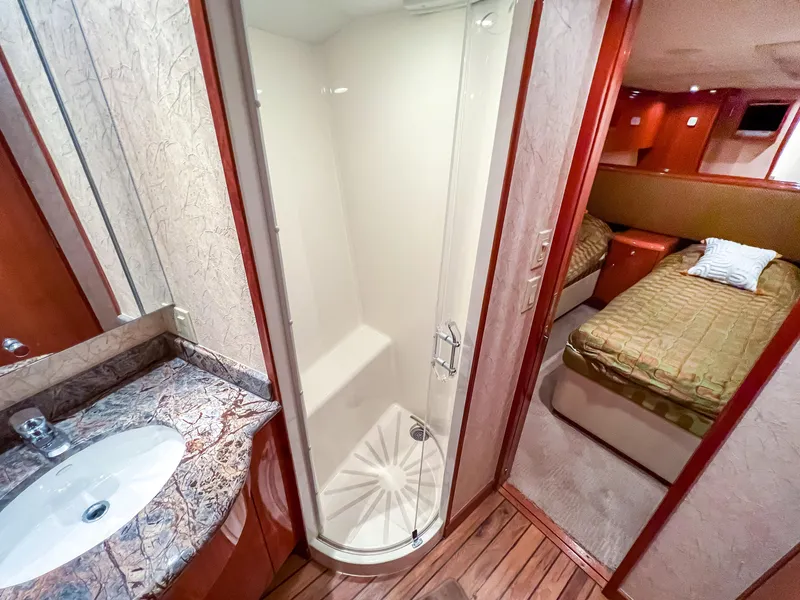 Slide: The Image of 2007 Hatteras 68 Convertible yacht interior with bathroom and bedroom view. - 31