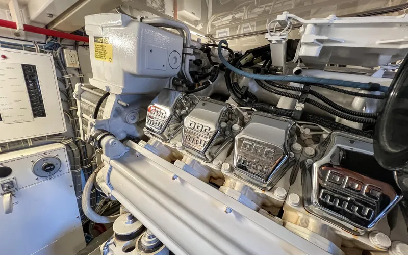 Slide: The Image of Engine room of 2007 Hatteras 68 Convertible yacht, showcasing powerful machinery and components. - 34