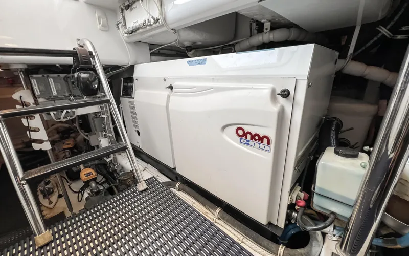 Slide: The Image of Engine room of 2007 Hatteras 68 Convertible yacht with Onan generator. - 38