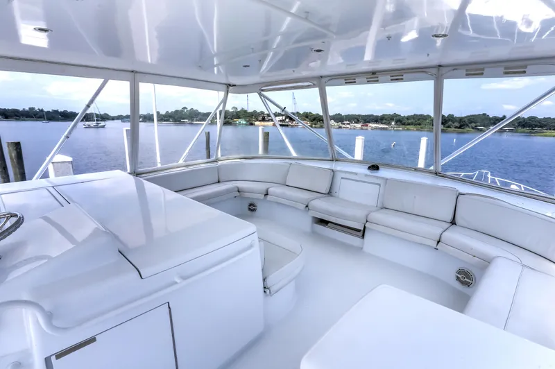 Slide: The Image of Luxurious 2007 Hatteras 68 Convertible yacht interior with spacious seating and scenic water view. - 9