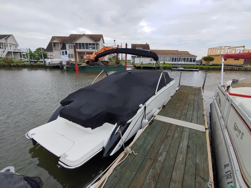 Slide: The Image of 2016 Cobalt R5 boat on a trailer under a clear sky. - 0