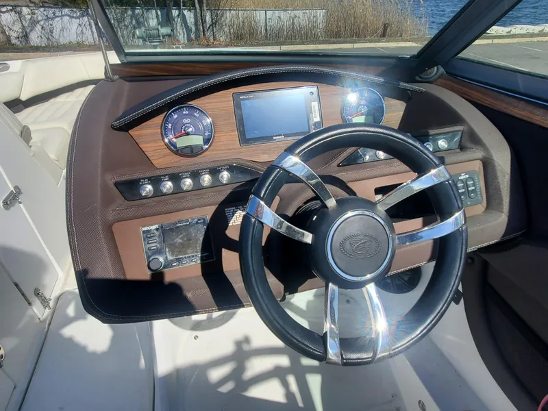 Slide: The Image of 2016 Cobalt R5 boat dashboard with steering wheel and navigation controls. - 13