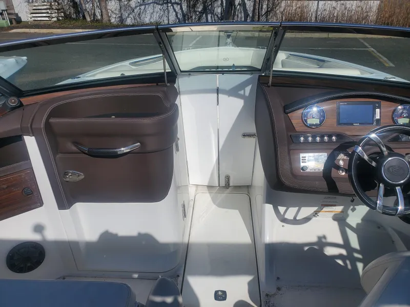 Slide: The Image of 2016 Cobalt R5 boat interior with steering wheel and dashboard. - 18