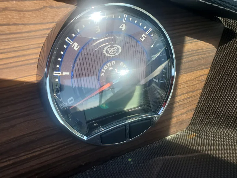 Slide: The Image of 2016 Cobalt R5 tachometer on wood grain dashboard. - 21