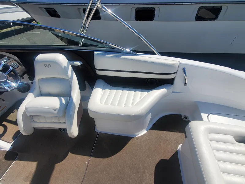 Slide: The Image of 2016 Cobalt R5 boat interior with white leather seats and steering console. - 26