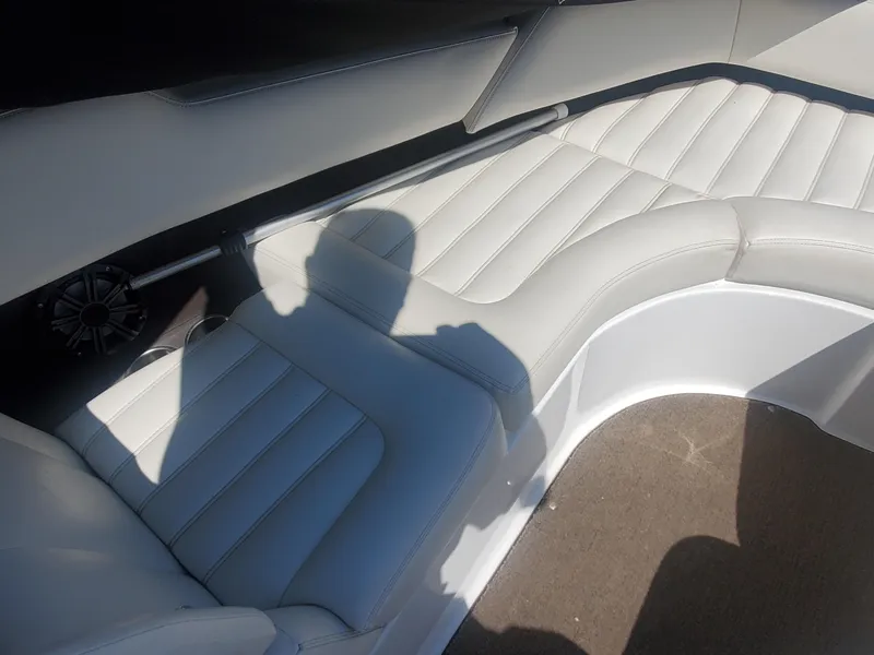 Slide: The Image of Interior seating of a 2016 Cobalt R5 boat with white upholstery. - 31