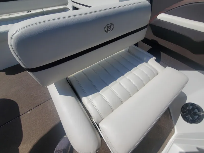 Slide: The Image of 2016 Cobalt R5 boat seat with white upholstery and black trim. - 34