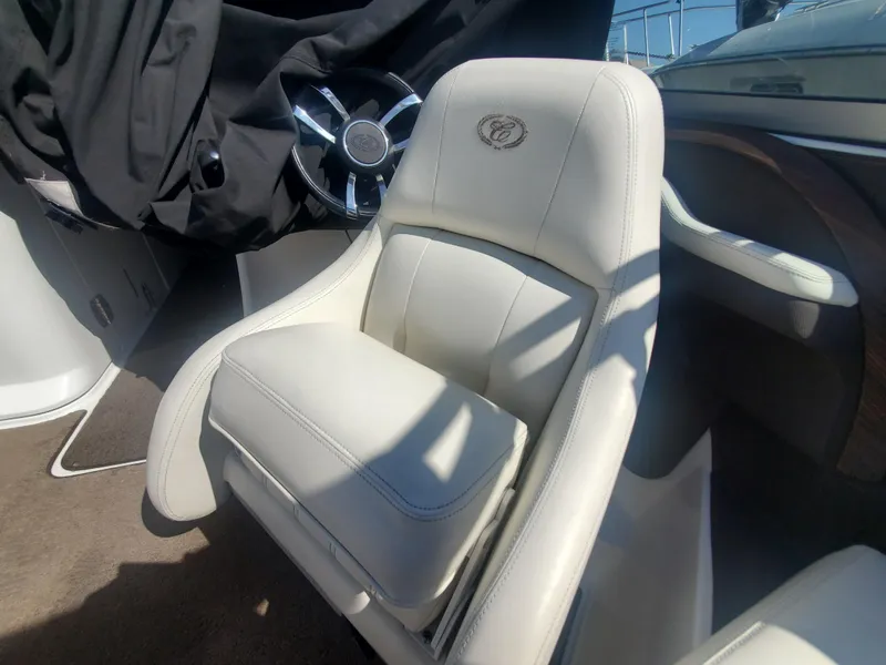 Slide: The Image of 2016 Cobalt R5 boat interior with white leather captain's chair. - 35