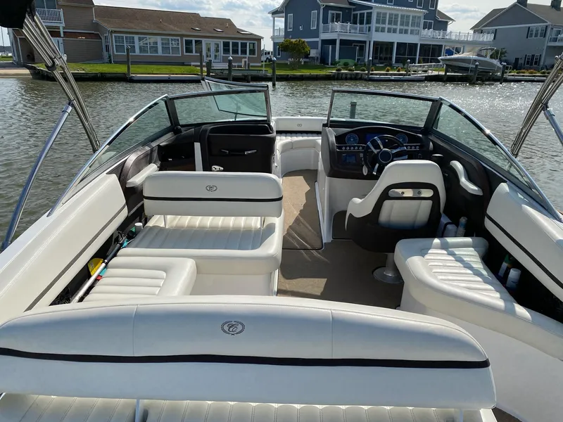 Slide: The Image of 2016 Cobalt R5 boat with white interior docked at a marina. - 5