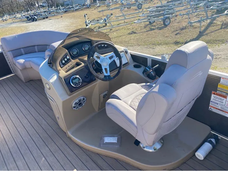 Slide: The Image of 2017 Bennington 22 GSR boat interior with captain's chair and control console. - 10