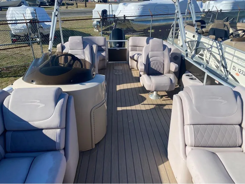 Slide: The Image of 2017 Bennington 22 GSR pontoon boat with spacious seating and modern helm. - 3