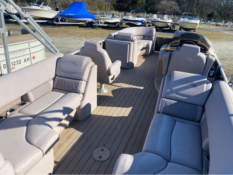 Slide: The Image of 2017 Bennington 22 GSR pontoon boat with spacious seating and modern interior design. - 7
