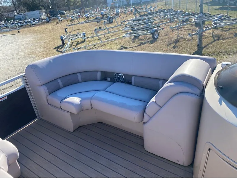 Slide: The Image of 2017 Bennington 22 GSR pontoon boat with beige seating and deck. - 8
