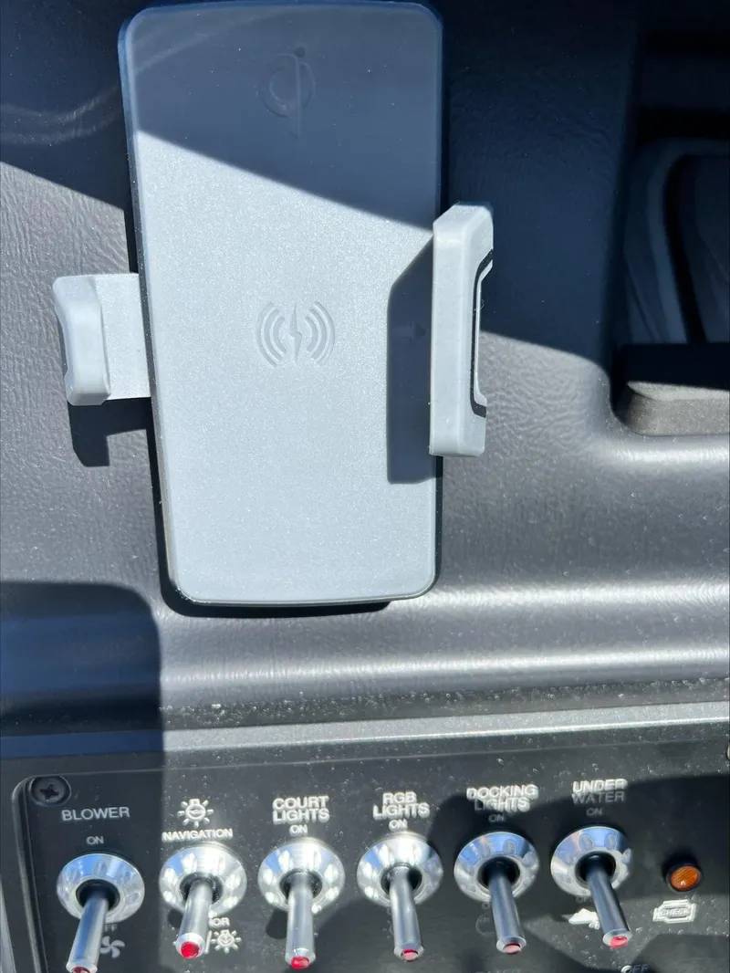Slide: The Image of 2024 Moomba Craz dashboard with phone holder and control switches. - 11