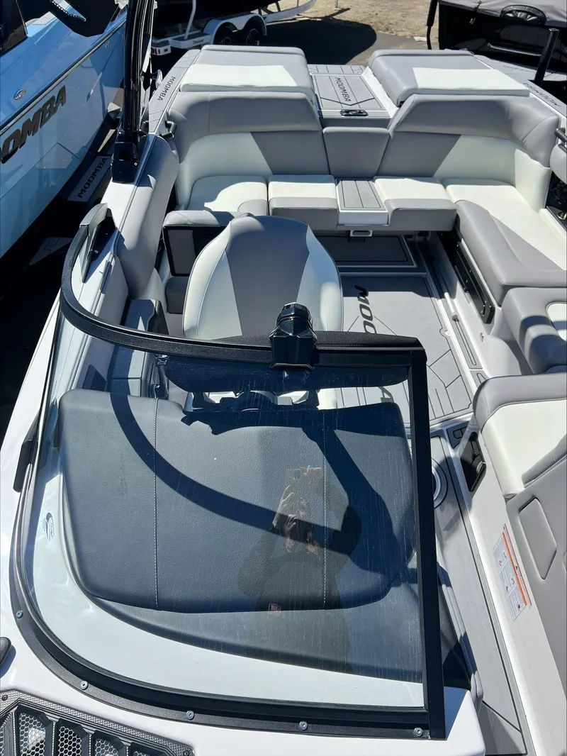 Slide: The Image of 2024 Moomba Craz boat interior with seating and windshield. - 12