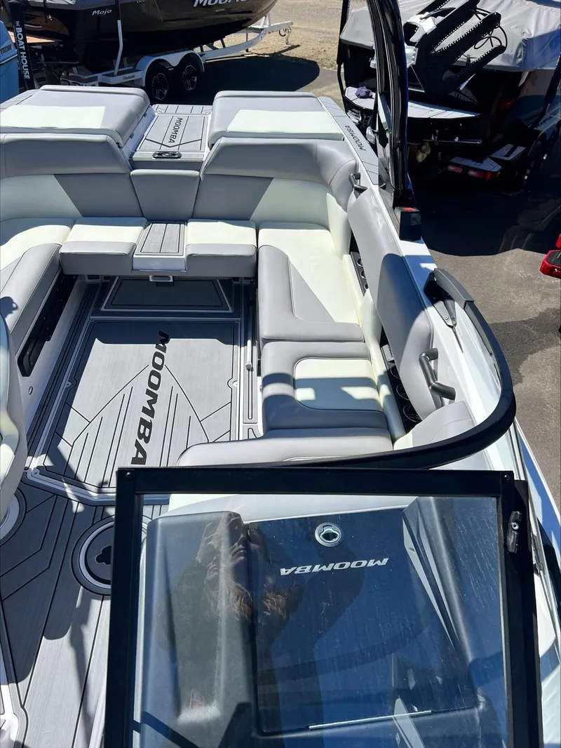 Slide: The Image of 2024 Moomba Craz boat interior with spacious seating and modern design. - 13