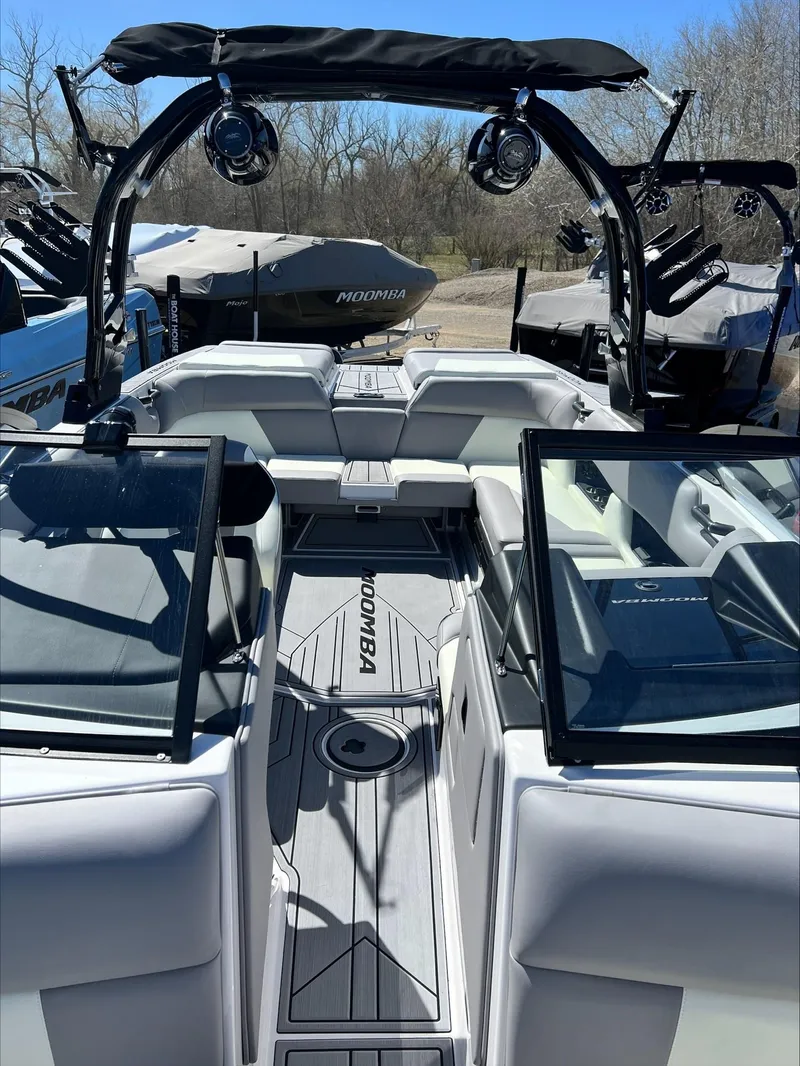 Slide: The Image of 2024 Moomba Craz boat interior with sleek seating and advanced audio system. - 14