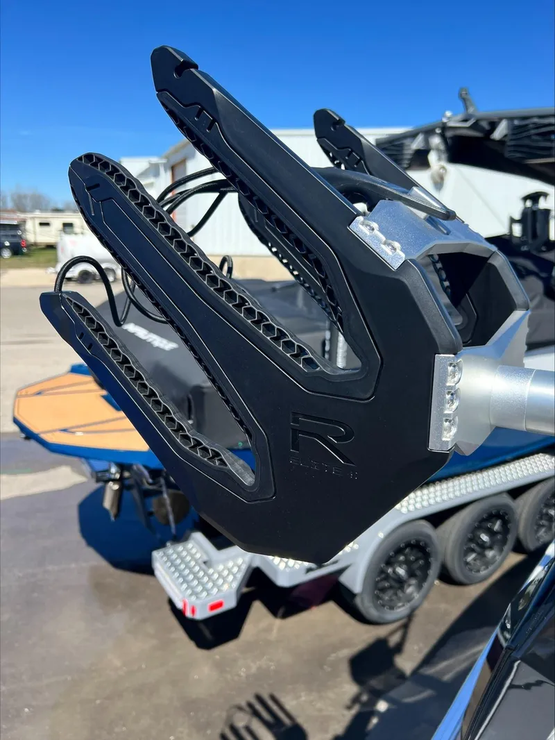 Slide: The Image of Close-up of 2024 Moomba Craz boat's wakeboard rack against a clear blue sky. - 18