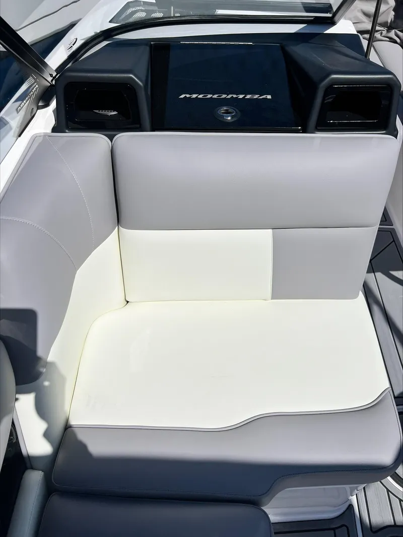 Slide: The Image of 2024 Moomba Craz boat interior with gray and white seating. - 8