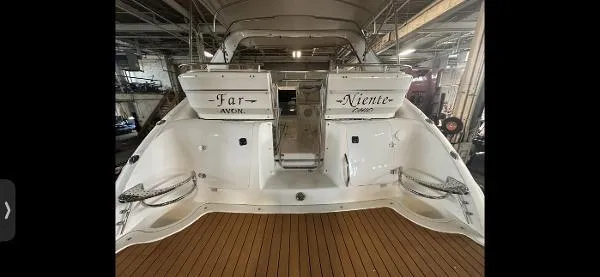 Slide: The Image of 2001 Doral 330se yacht in a marina, rear view. - 10