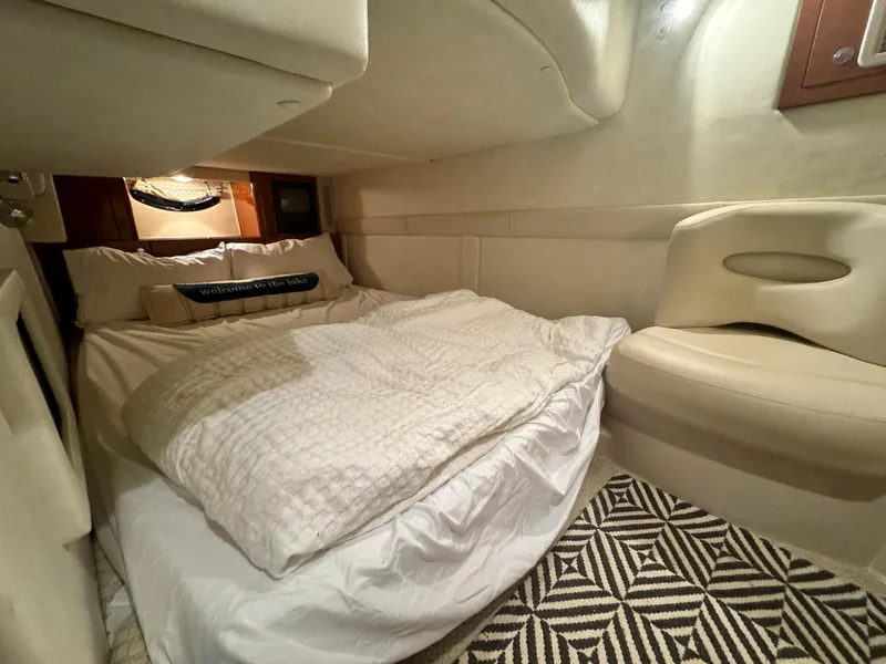 Slide: The Image of Cozy cabin interior of a 2001 Doral 330se boat with a comfortable bed. - 12
