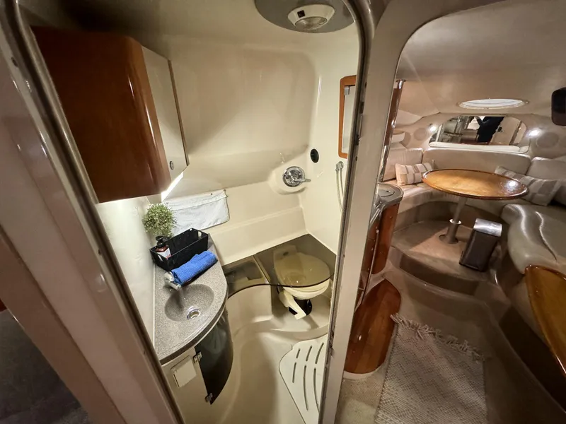 Slide: The Image of 2001 Doral 330se yacht interior with bathroom and seating area. - 18