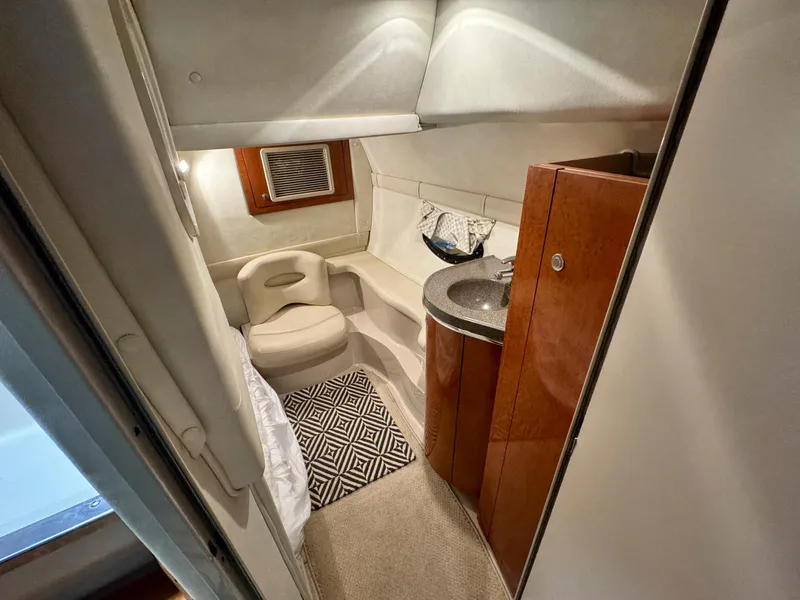 Slide: The Image of Interior cabin of a 2001 Doral 330se boat with seating and sink. - 19