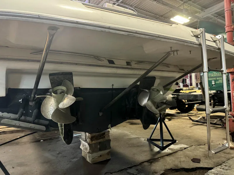 Slide: The Image of 2001 Doral 330se boat in a workshop, showing dual propellers and stern. - 22