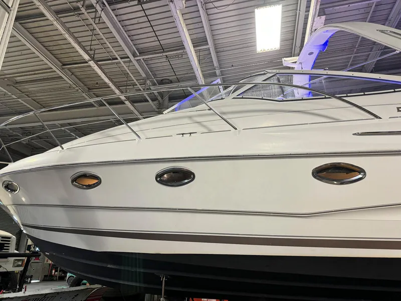 Slide: The Image of 2001 Doral 330se boat in a warehouse, side view. - 3