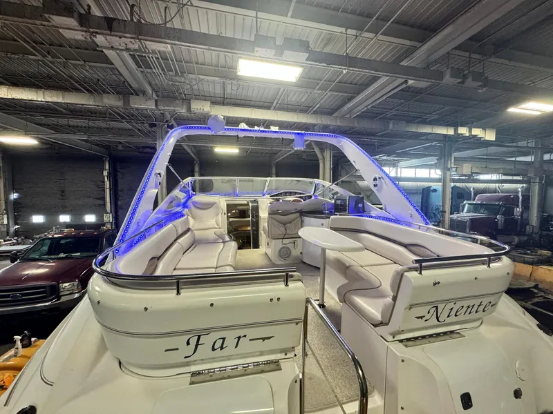 Slide: The Image of 2001 Doral 330se yacht with blue LED lights in a warehouse. - 6