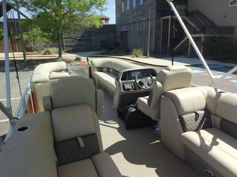 Slide: The Image of 2024 Sun Tracker Party Barge 24 DLX pontoon boat with spacious seating and modern helm. - 8