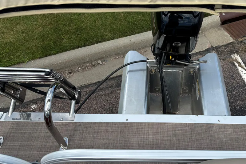 Slide: The Image of 2024 Sun Tracker Bass Buggy 16 XL Select boat motor and deck view. - 10