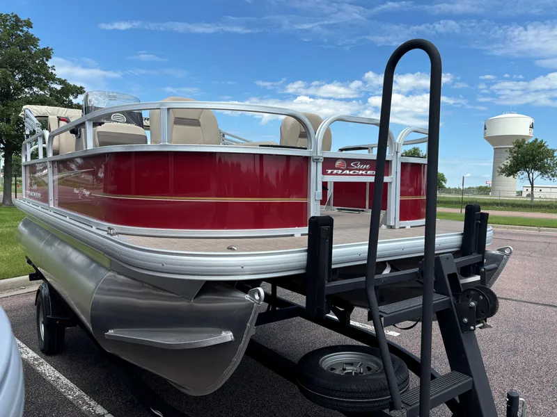 Slide: The Image of 2024 Sun Tracker Bass Buggy 16 XL Select pontoon boat on trailer. - 3