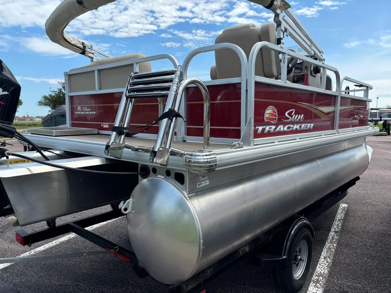 Slide: The Image of 2024 Sun Tracker Bass Buggy 16 XL Select pontoon boat on trailer. - 4