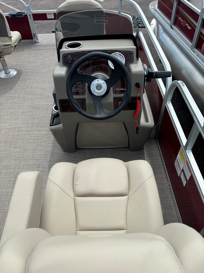 Slide: The Image of 2024 Sun Tracker Bass Buggy 16 XL Select boat interior with steering console and seating. - 7