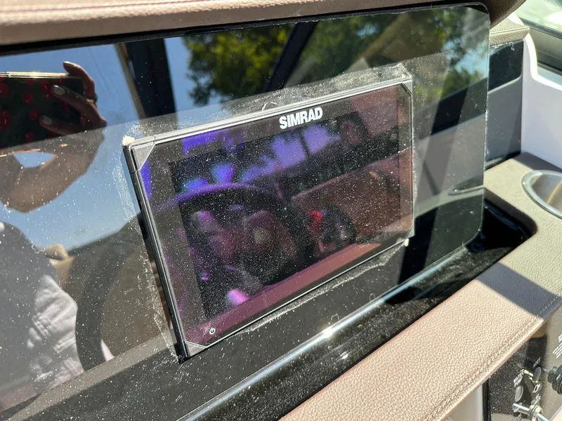 Slide: The Image of Simrad display on the dashboard of a 2024 Sea Ray SDX 250 boat. - 17