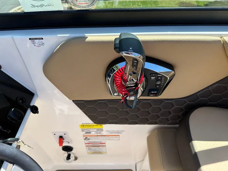 Slide: The Image of 2024 Sea Ray SDX 250 boat control panel with throttle and safety lanyard. - 19