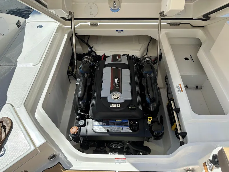 Slide: The Image of 2024 Sea Ray SDX 250 boat engine compartment with 350 HP engine. - 26